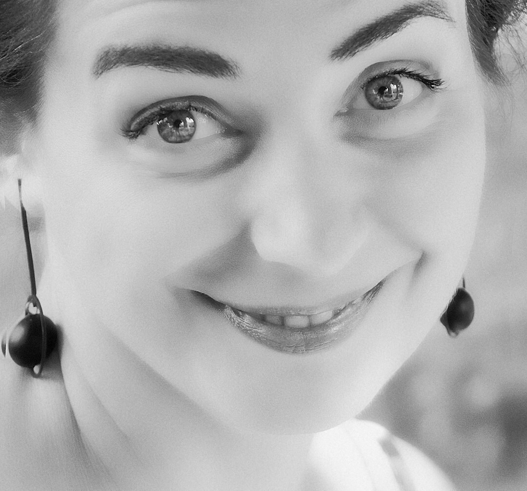 Studio portrait of a Chilean woman editor in chief smiling