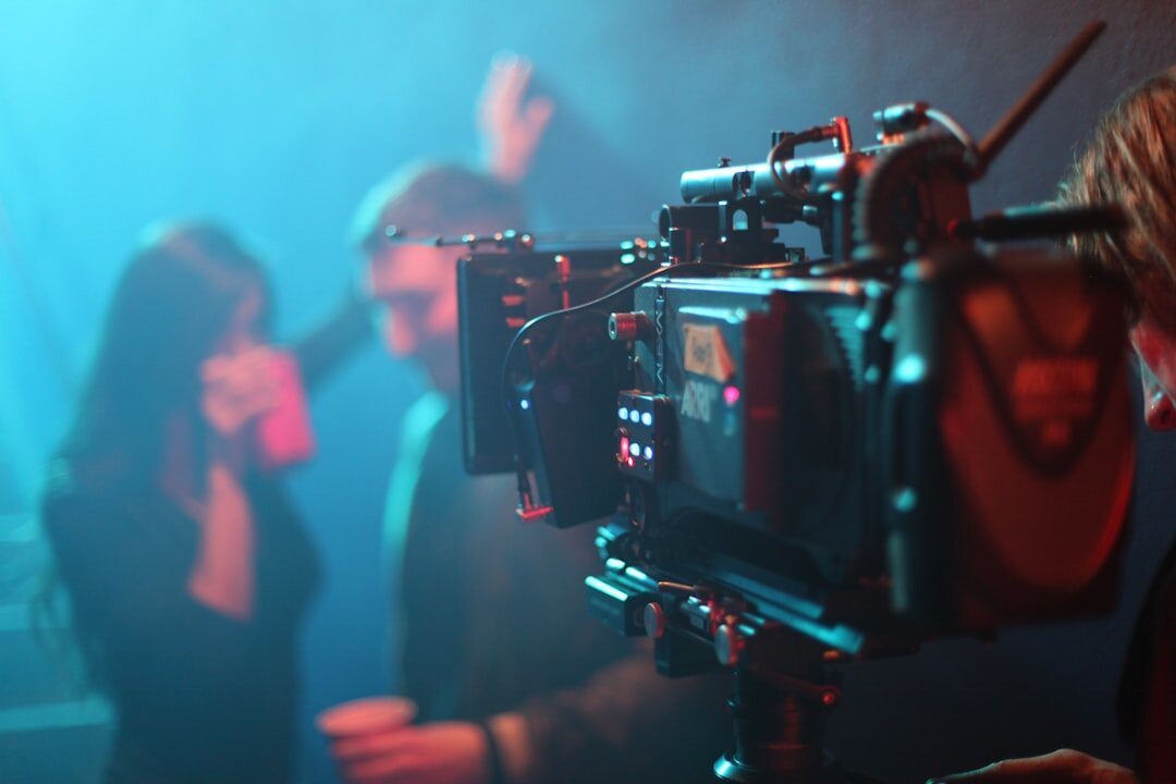 Group of photographers with cameras covering a celebrity event at night